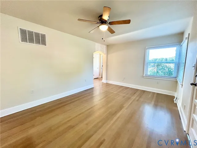a view of a kitchen counter space wooden floor and staircase