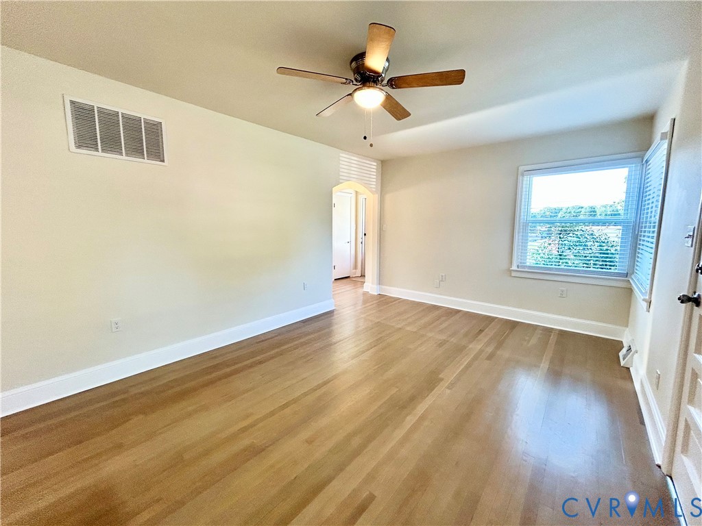 411 Hillcrest Avenue Colonial Heights, VA 23834 - Photo 16 of 33 a view of an empty room with wooden floor and a window