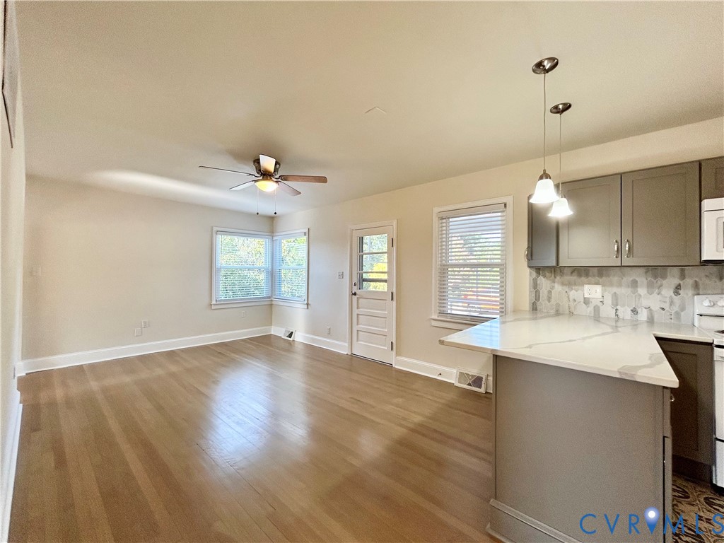 411 Hillcrest Avenue Colonial Heights, VA 23834 - Photo 17 of 33 a view of a kitchen counter space wooden floor and staircase