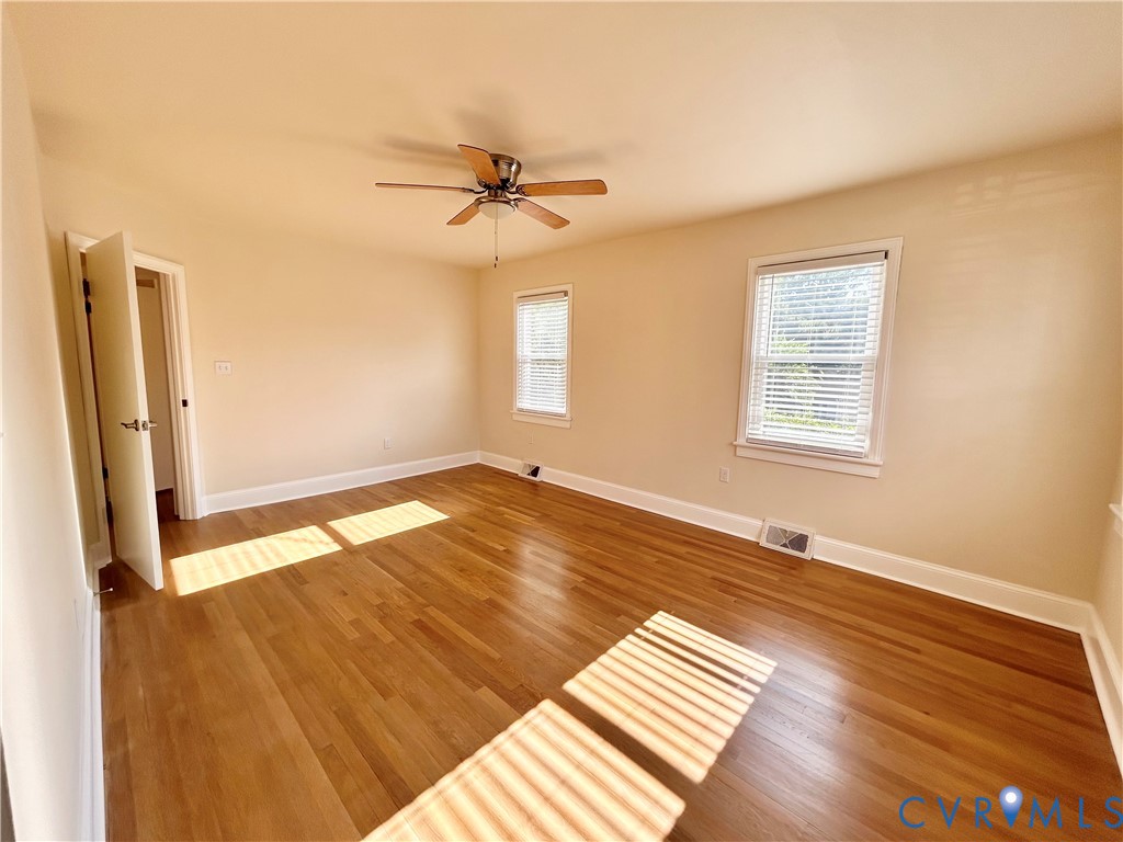 411 Hillcrest Avenue Colonial Heights, VA 23834 - Photo 23 of 33 wooden floor in an empty room with a window