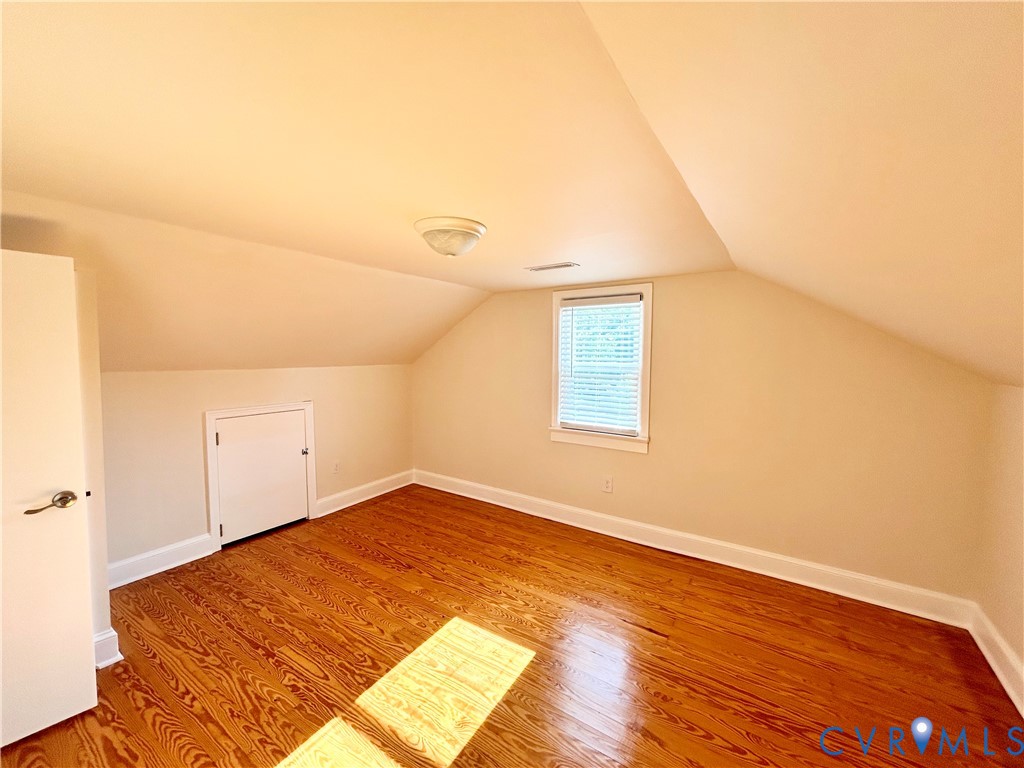 411 Hillcrest Avenue Colonial Heights, VA 23834 - Photo 27 of 33 an empty room with wooden floor and windows