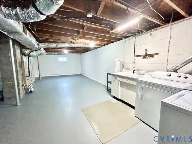 a kitchen with a refrigerator a sink and cabinets