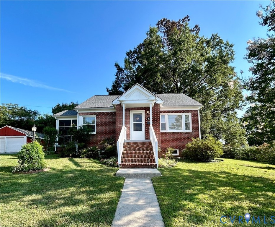 411 Hillcrest Avenue Colonial Heights, VA 23834 - Photo 3 of 33 a front view of a house with garden