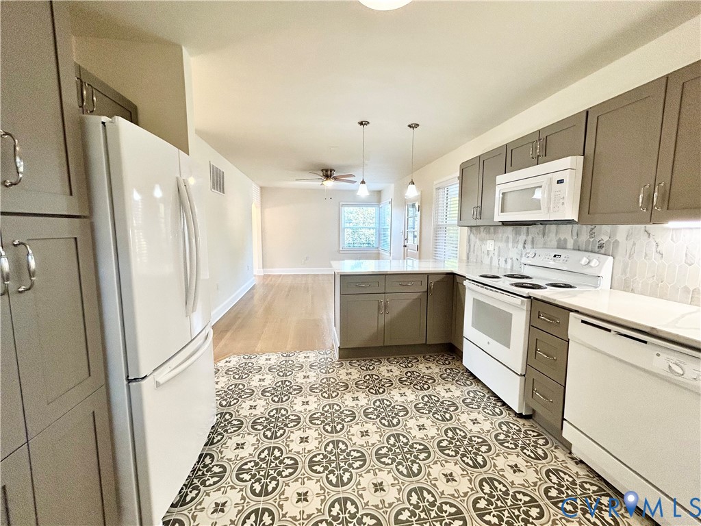411 Hillcrest Avenue Colonial Heights, VA 23834 - Photo 32 of 33 a kitchen with a refrigerator a sink and cabinets