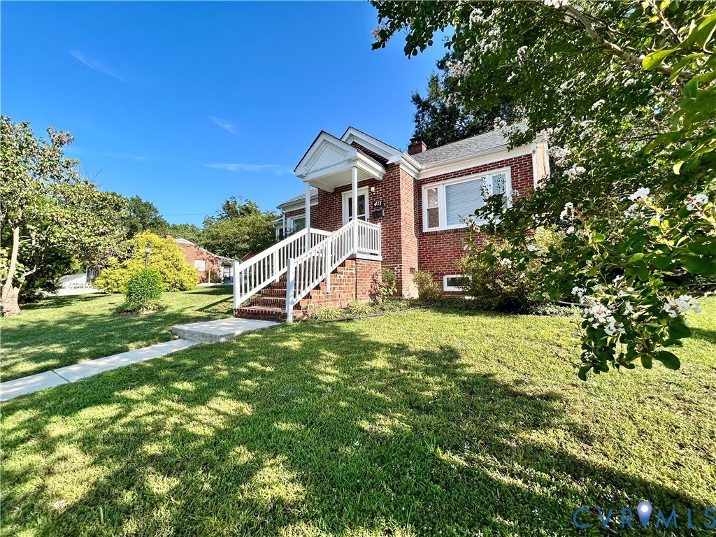 411 Hillcrest Avenue Colonial Heights, VA 23834 - Photo 5 of 33 a front view of a house with a yard