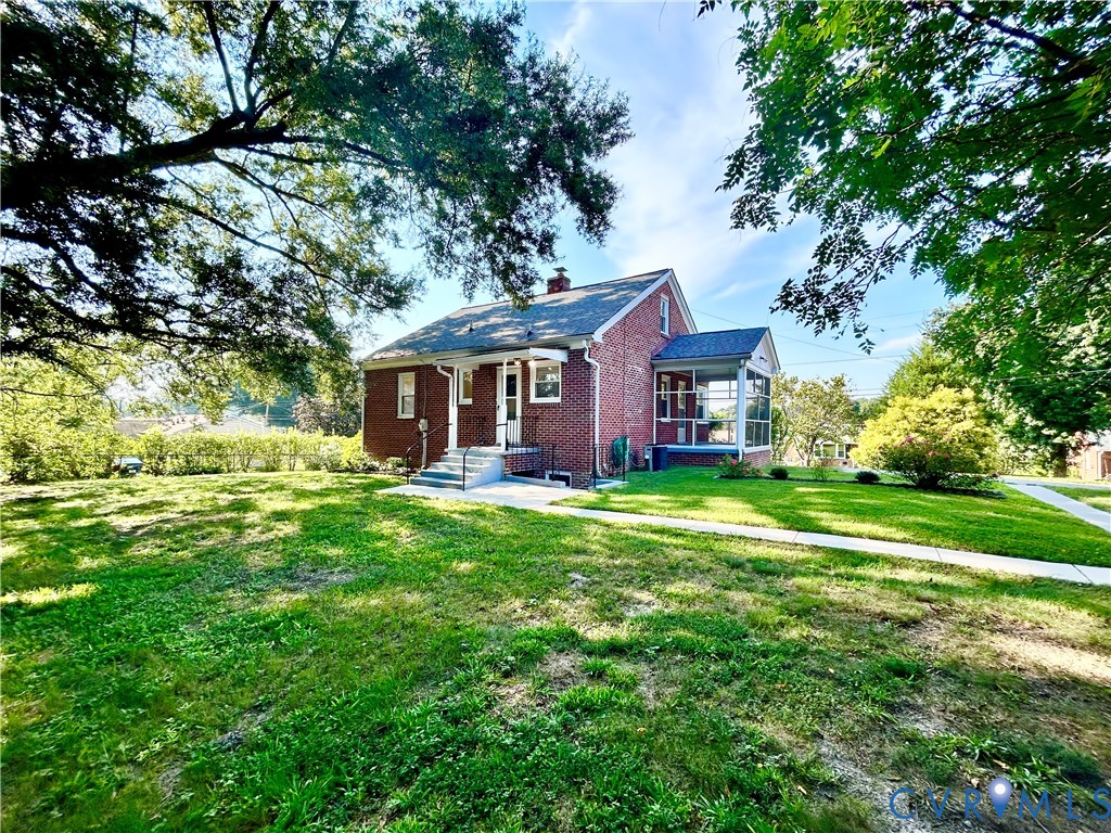 411 Hillcrest Avenue Colonial Heights, VA 23834 - Photo 7 of 33 a view of a house with a big yard plants and large trees