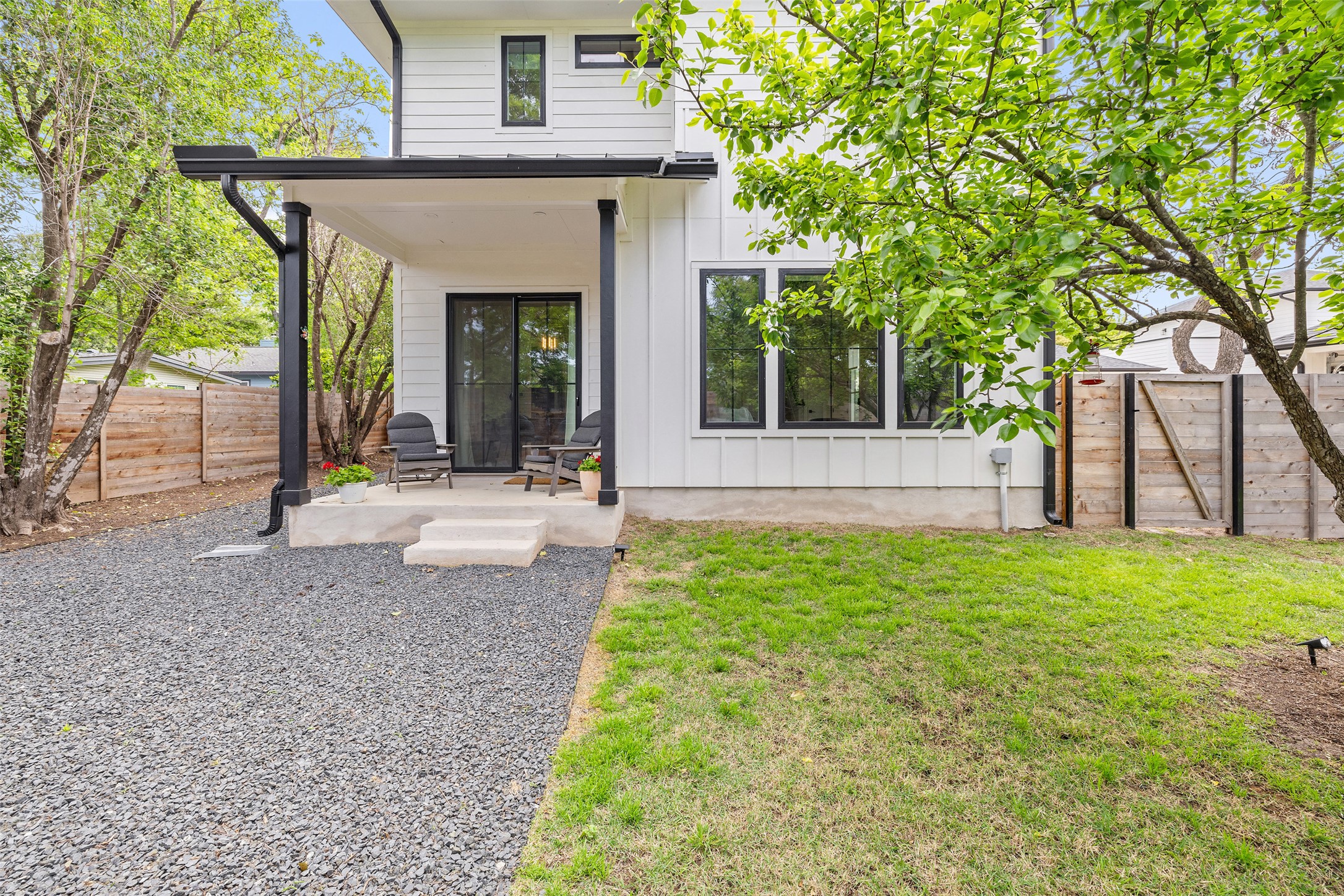 1504 Ruth Avenue, Unit 3 Austin, TX 78757 - Photo 33 of 39 A private covered patio provides a tranquil outdoor retreat with ample yard space.