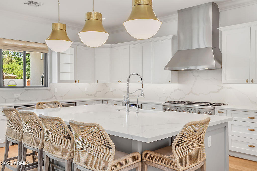 3924 East Roma Avenue Phoenix, AZ 85018 - Photo 11 of 32 a kitchen with a table and chairs in it