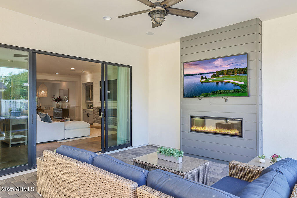 3924 East Roma Avenue Phoenix, AZ 85018 - Photo 20 of 32 a living room with furniture and a flat screen tv