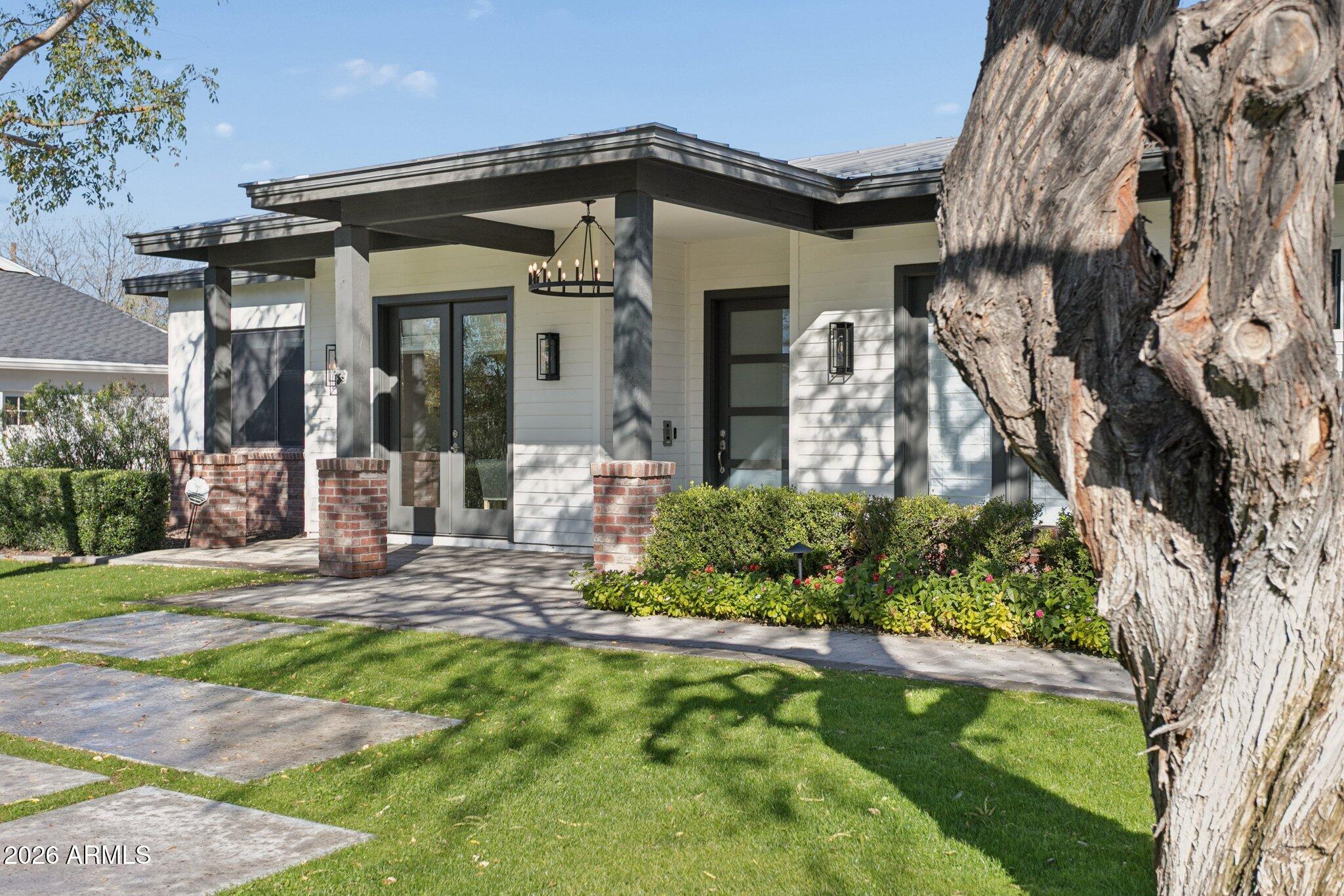 3924 East Roma Avenue Phoenix, AZ 85018 - Photo 2 of 32 a front view of a house with garden