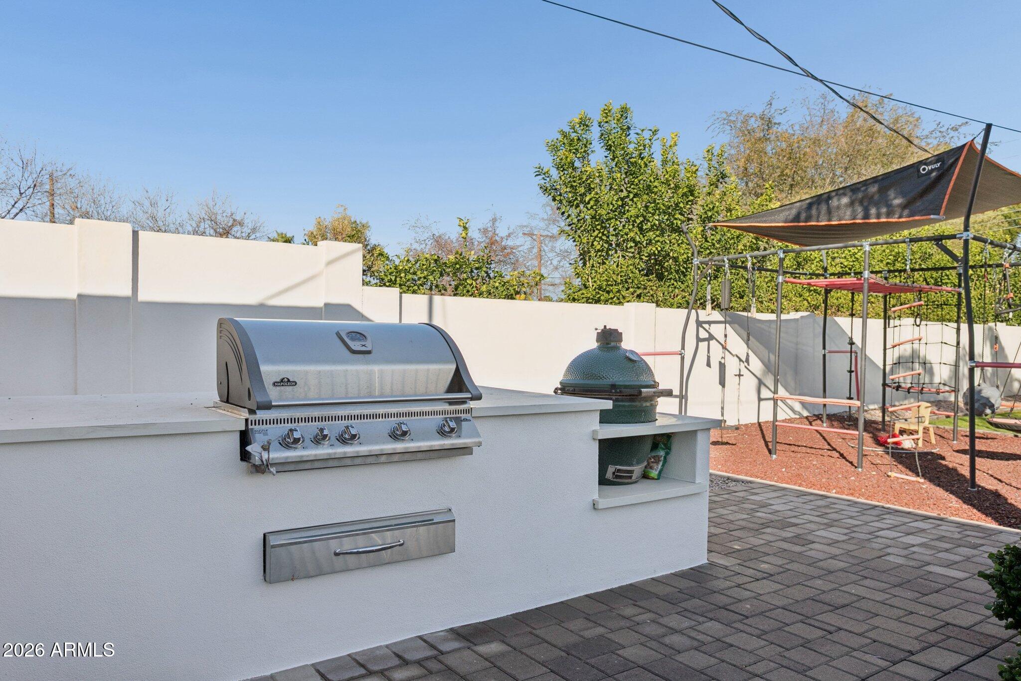 3924 East Roma Avenue Phoenix, AZ 85018 - Photo 21 of 32 a view of barbeque grill with seating area