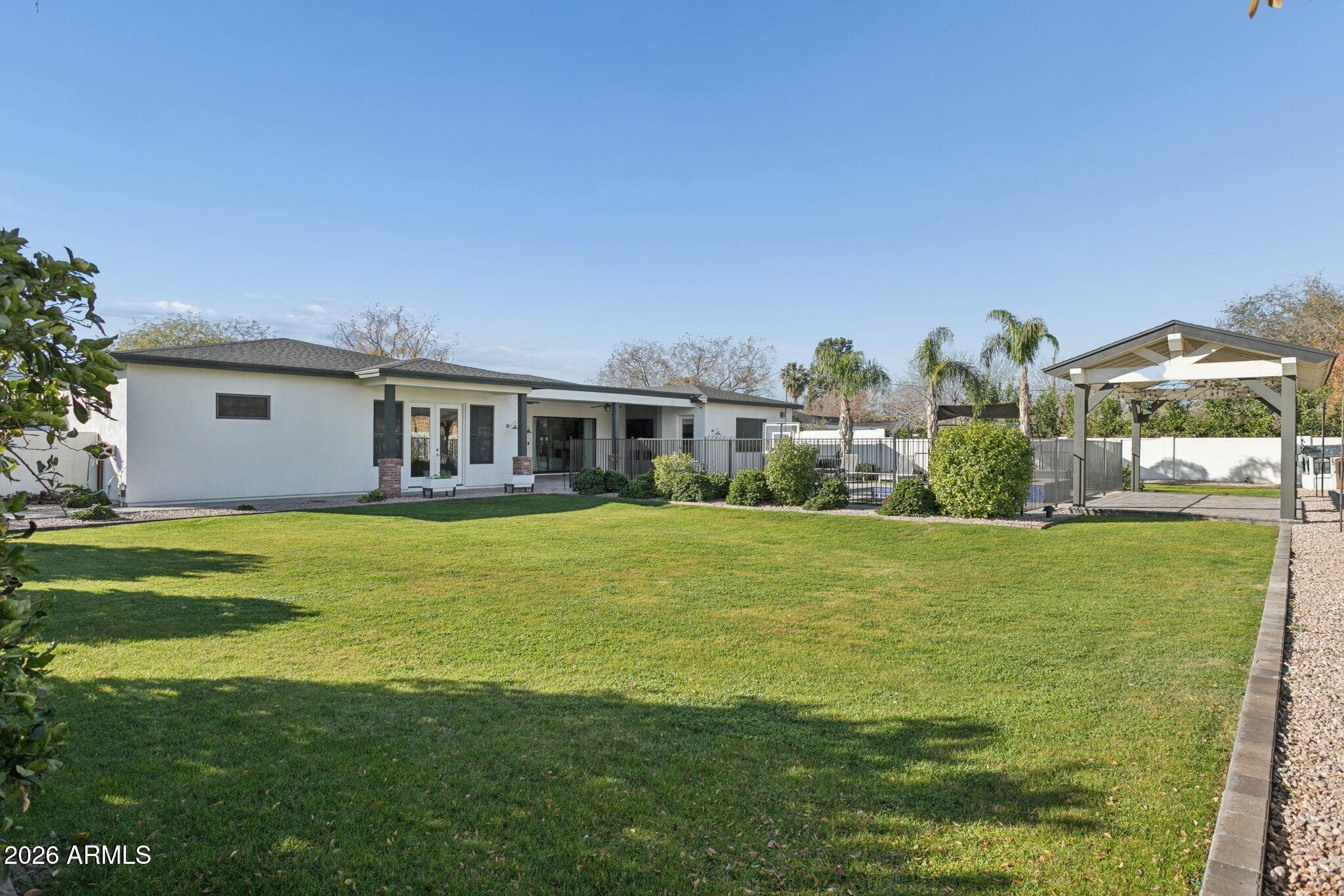 3924 East Roma Avenue Phoenix, AZ 85018 - Photo 26 of 32 a front view of a house with a garden
