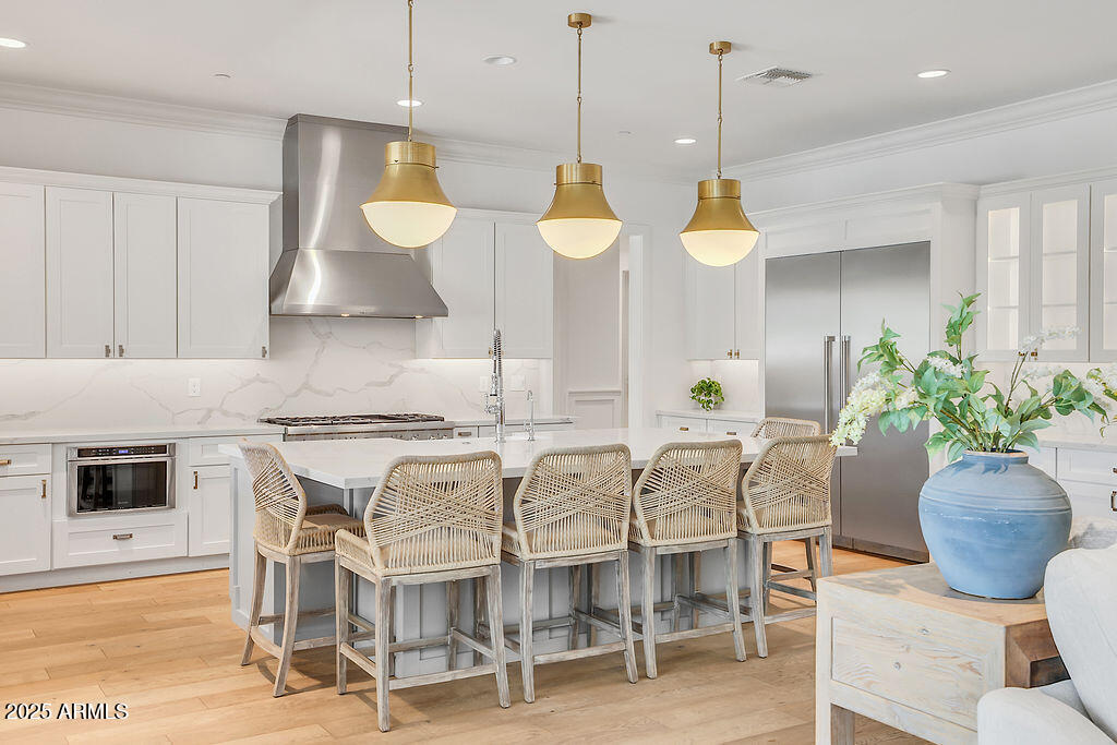 3924 East Roma Avenue Phoenix, AZ 85018 - Photo 10 of 32 a kitchen with cabinets table and chairs