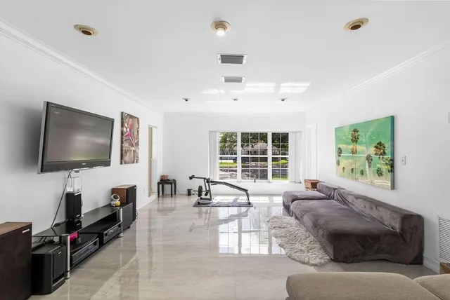 a living room with furniture a window and a couch