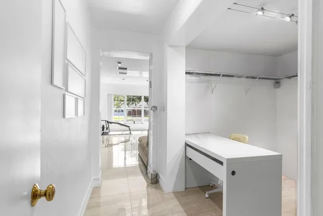 a spacious bathroom with a granite countertop tub sink and mirror