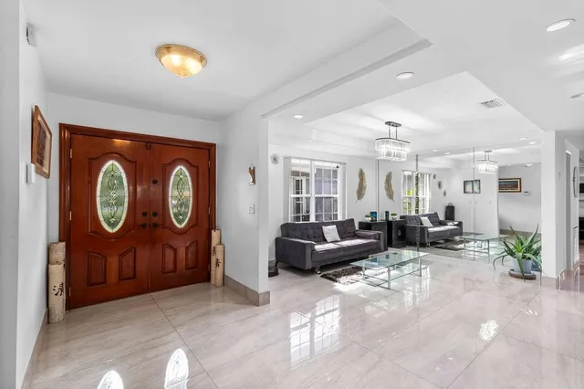 a spacious bedroom with a bed and a couch