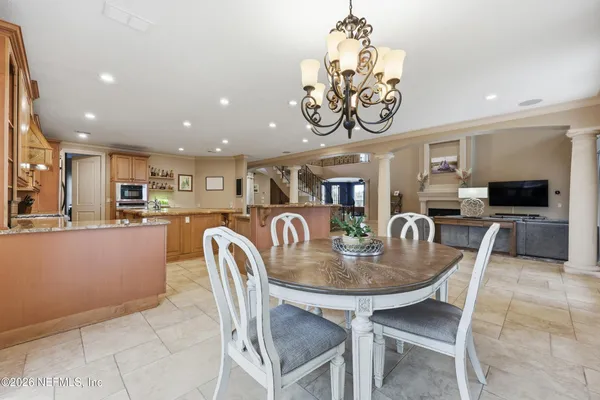 a view of a room with gym equipment and floor to ceiling window