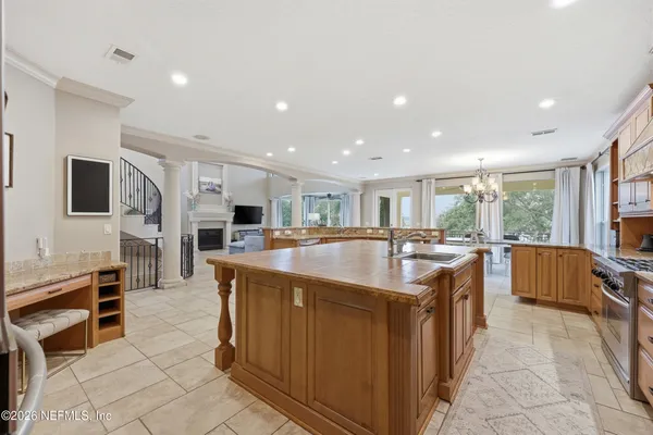 a bathroom with a granite countertop sink mirror and a shower