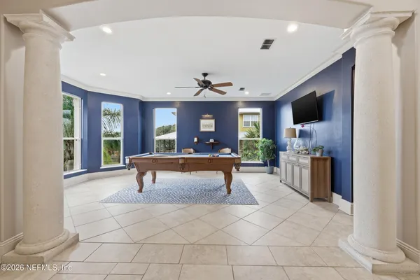 a view of a swimming pool with a patio