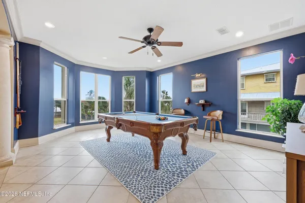 a view of a room with wooden floor and bench