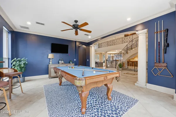 a view of a balcony with wooden floor and seating space