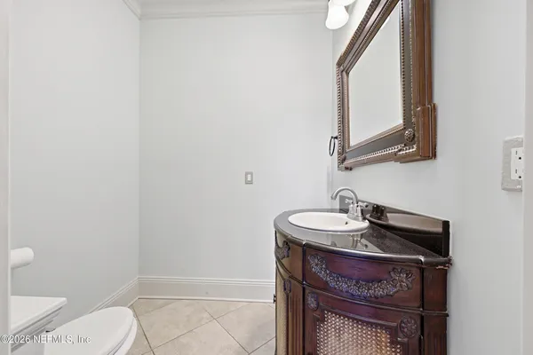 an aerial view of residential houses with outdoor space and river