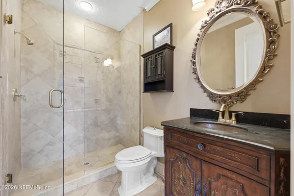 an aerial view of a house with a lake view