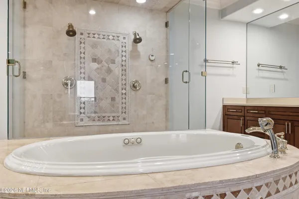 an aerial view of a city with lots of residential buildings lake and ocean view