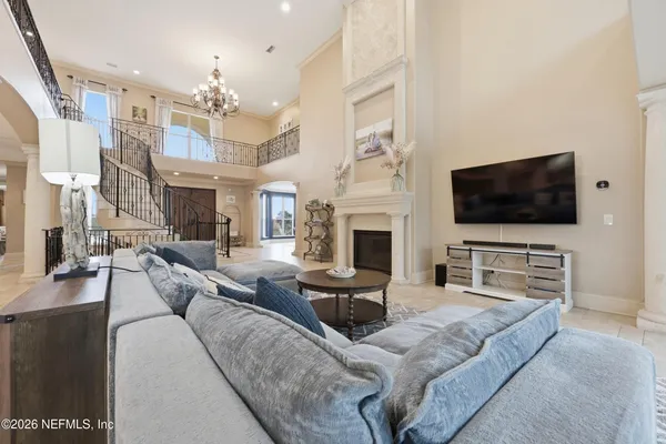 a view of a kitchen with granite countertop a sink and a stove top oven