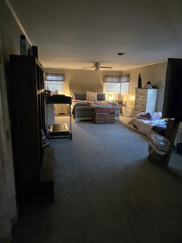 a view of a livingroom with furniture and a livingroom