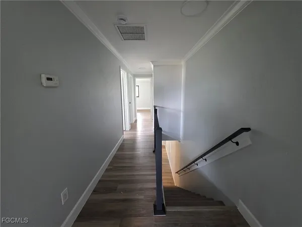 a view of entryway with wooden floor