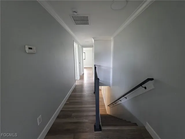 a view of entryway with wooden floor