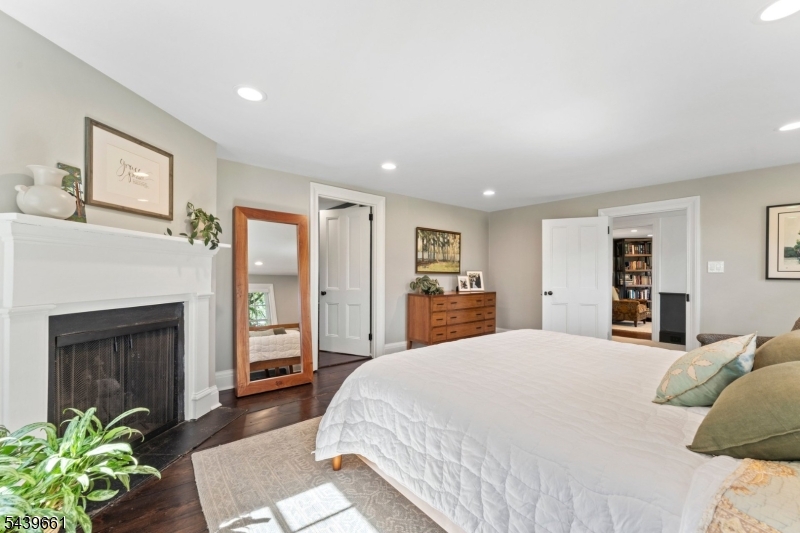 29 Bedens Brook Road Skillman, NJ 08558 - Photo 29 of 50 a large bedroom with a bed and a fireplace