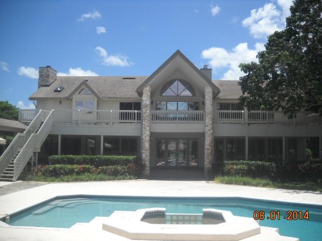8601 Surrey Lane Boca Raton, FL 33496 - Photo 17 of 18 a front view of a house with garden