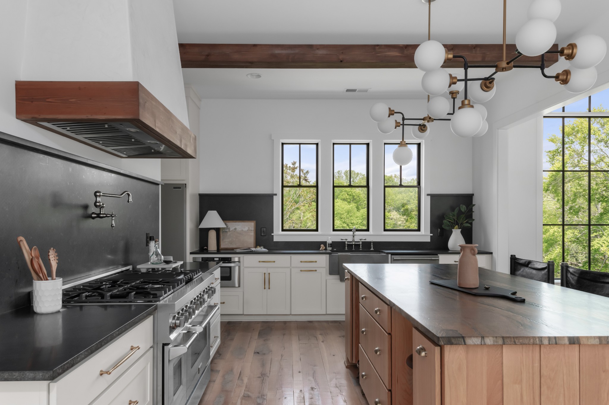 3551 Bailey Road Franklin, TN 37064 - Photo 26 of 52 a kitchen with a stove a sink a window and cabinets