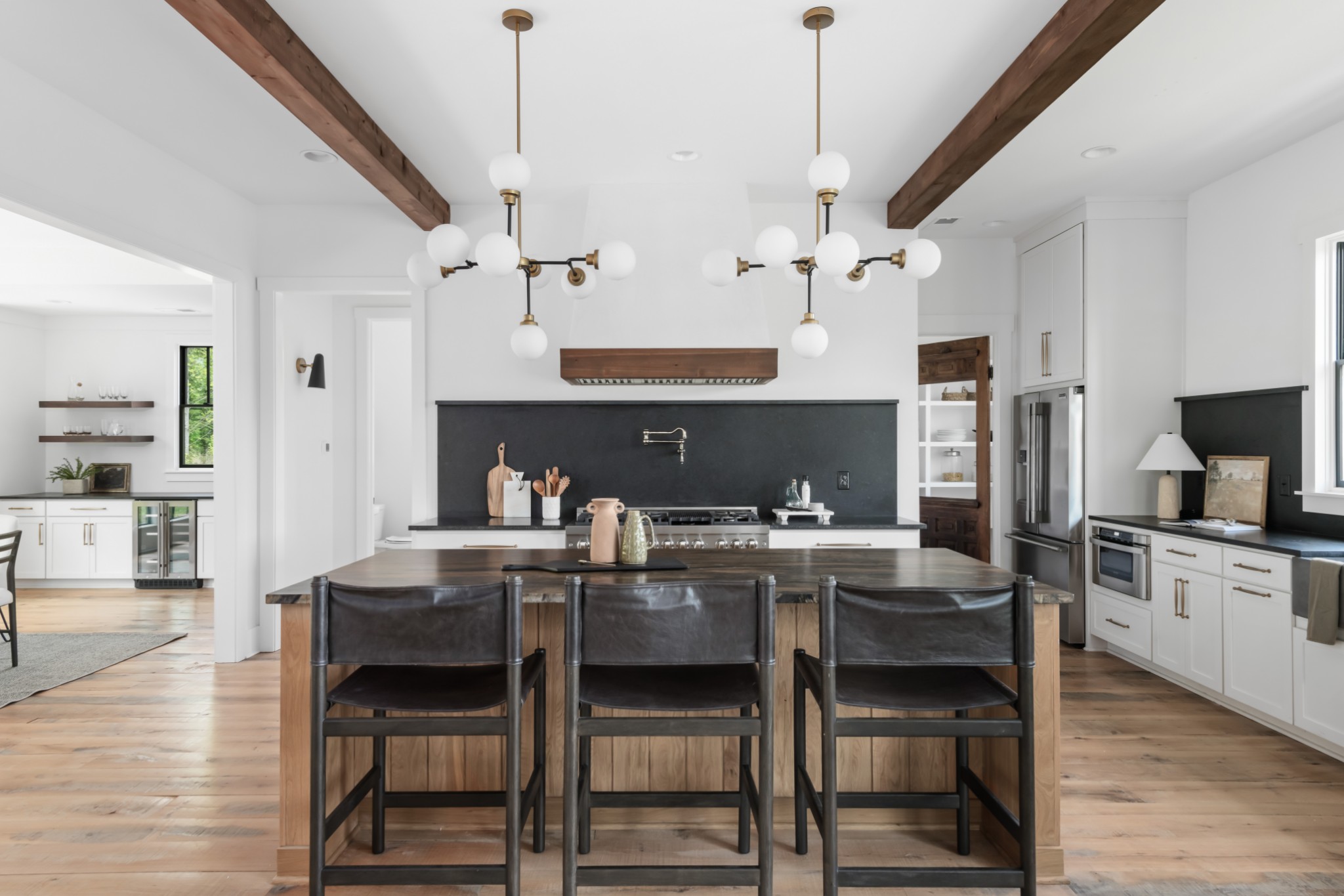 3551 Bailey Road Franklin, TN 37064 - Photo 3 of 52 a kitchen with a dining table chairs and white cabinets