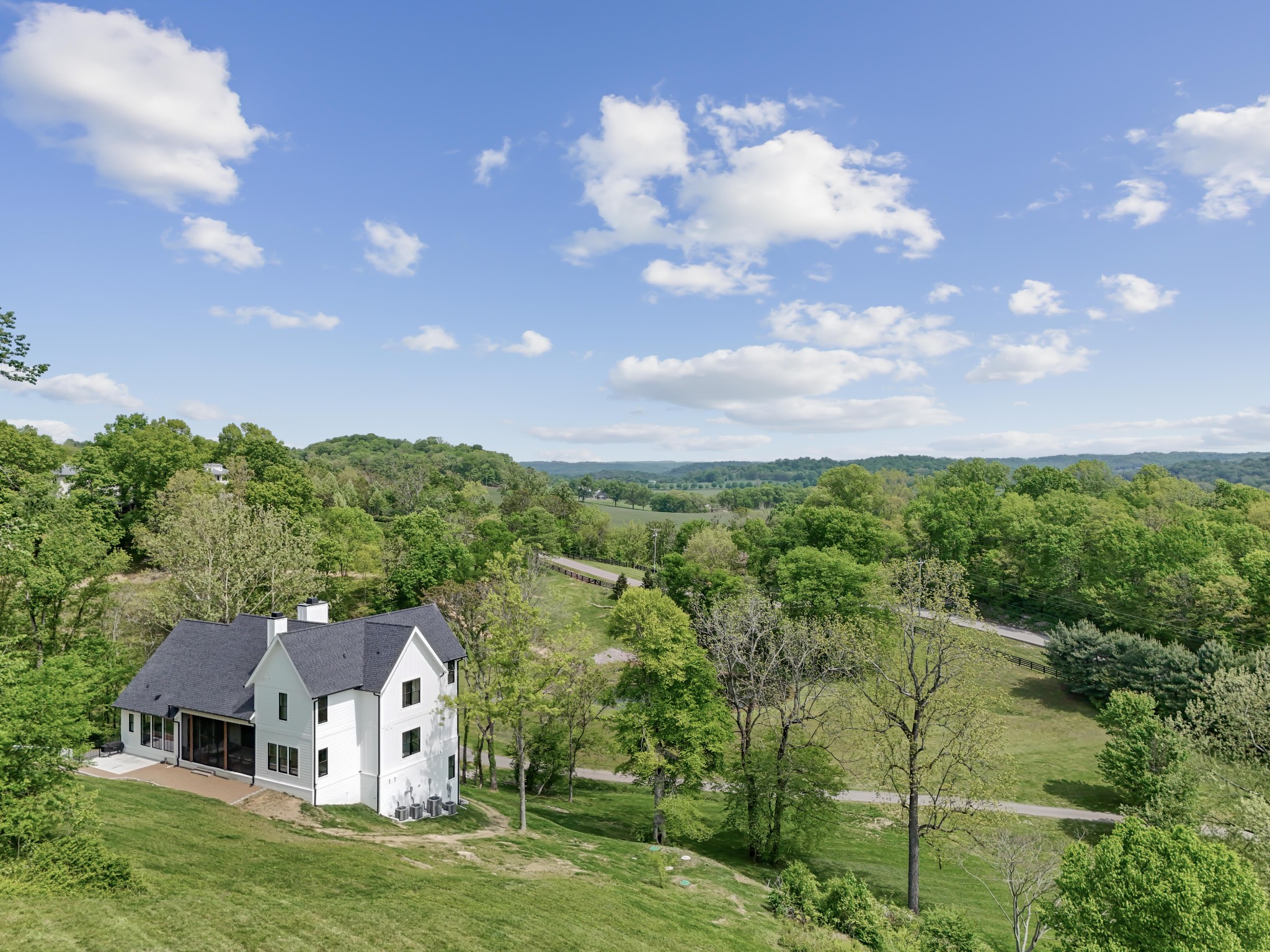 3551 Bailey Road Franklin, TN 37064 - Photo 37 of 52 a view of a big house with a big yard and large trees
