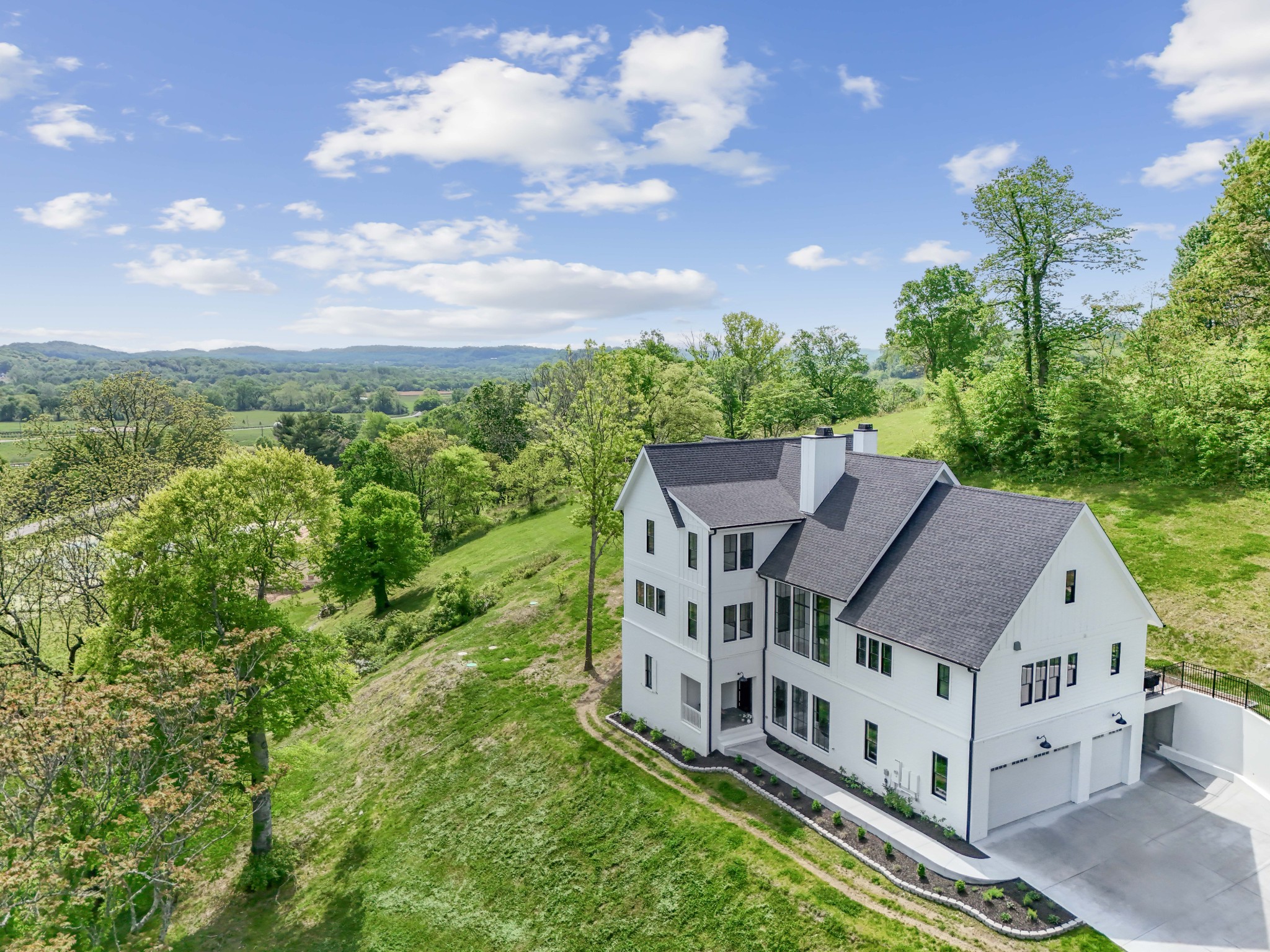 3551 Bailey Road Franklin, TN 37064 - Photo 4 of 52 a view of a big house with a big yard and large trees