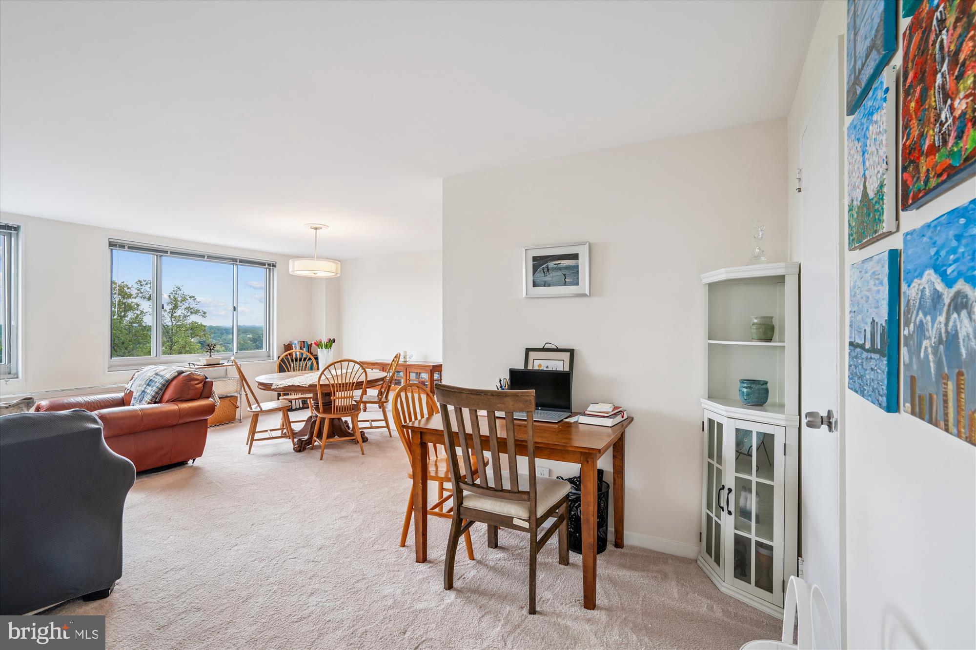 1900 Lyttonsville Road, Unit 1308 Silver Spring, MD 20910 - Photo 5 of 52 a dining room with furniture and a flat screen tv