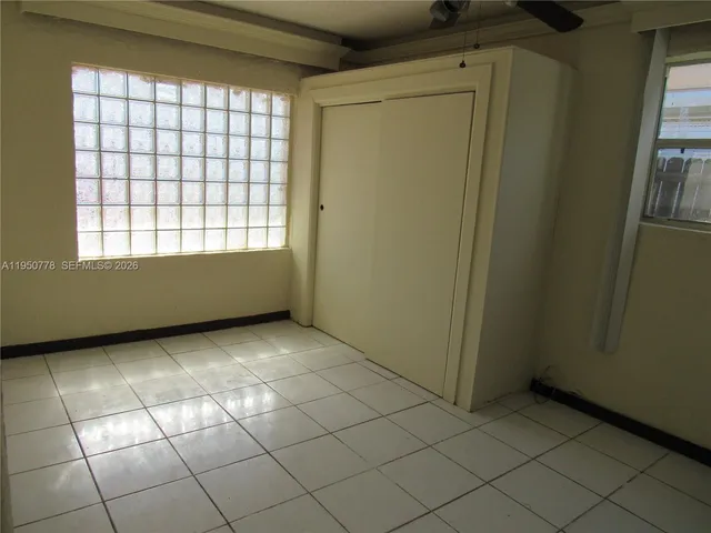 a view of an empty room and window