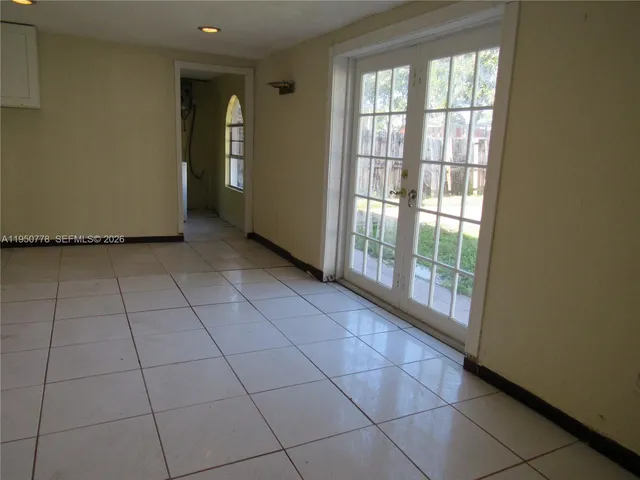 a view of an empty room and window