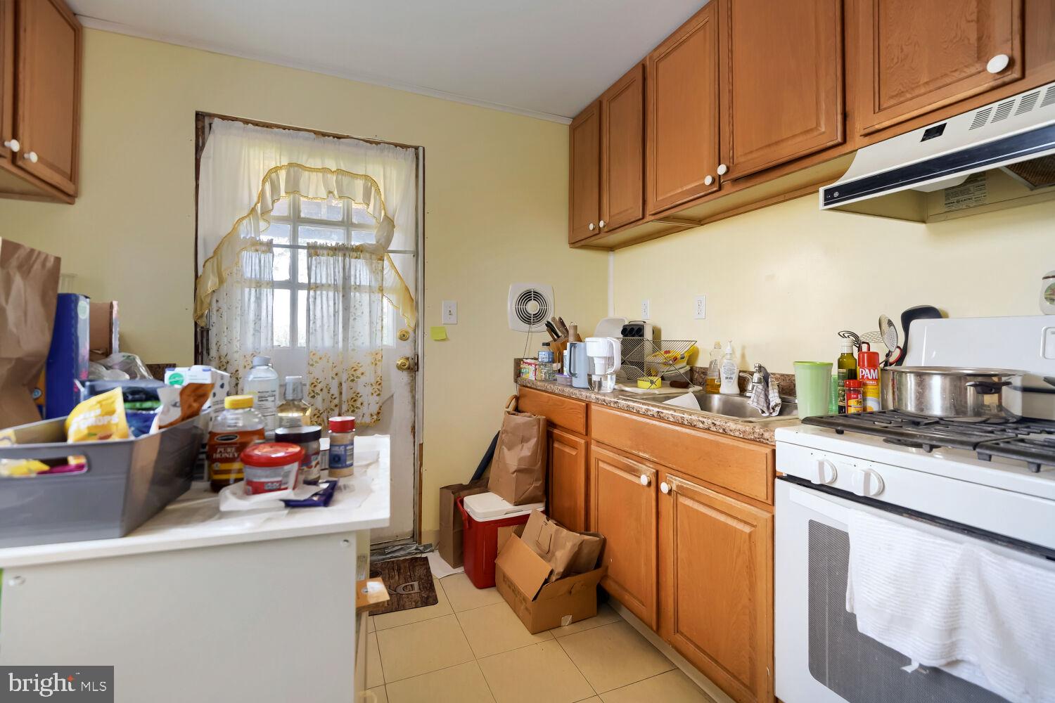 8413 Philadelphia Road Baltimore, MD 21237 - Photo 20 of 27 Cozy kitchen with warm wooden tones.