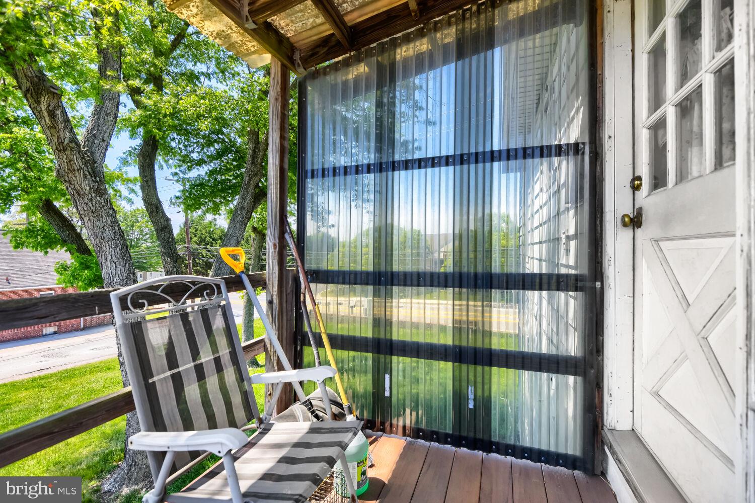 8413 Philadelphia Road Baltimore, MD 21237 - Photo 25 of 27 Charming porch with serene views.
