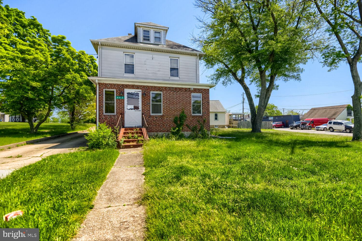 8413 Philadelphia Road Baltimore, MD 21237 - Photo 3 of 27 Charming brick home with lush greenery.
