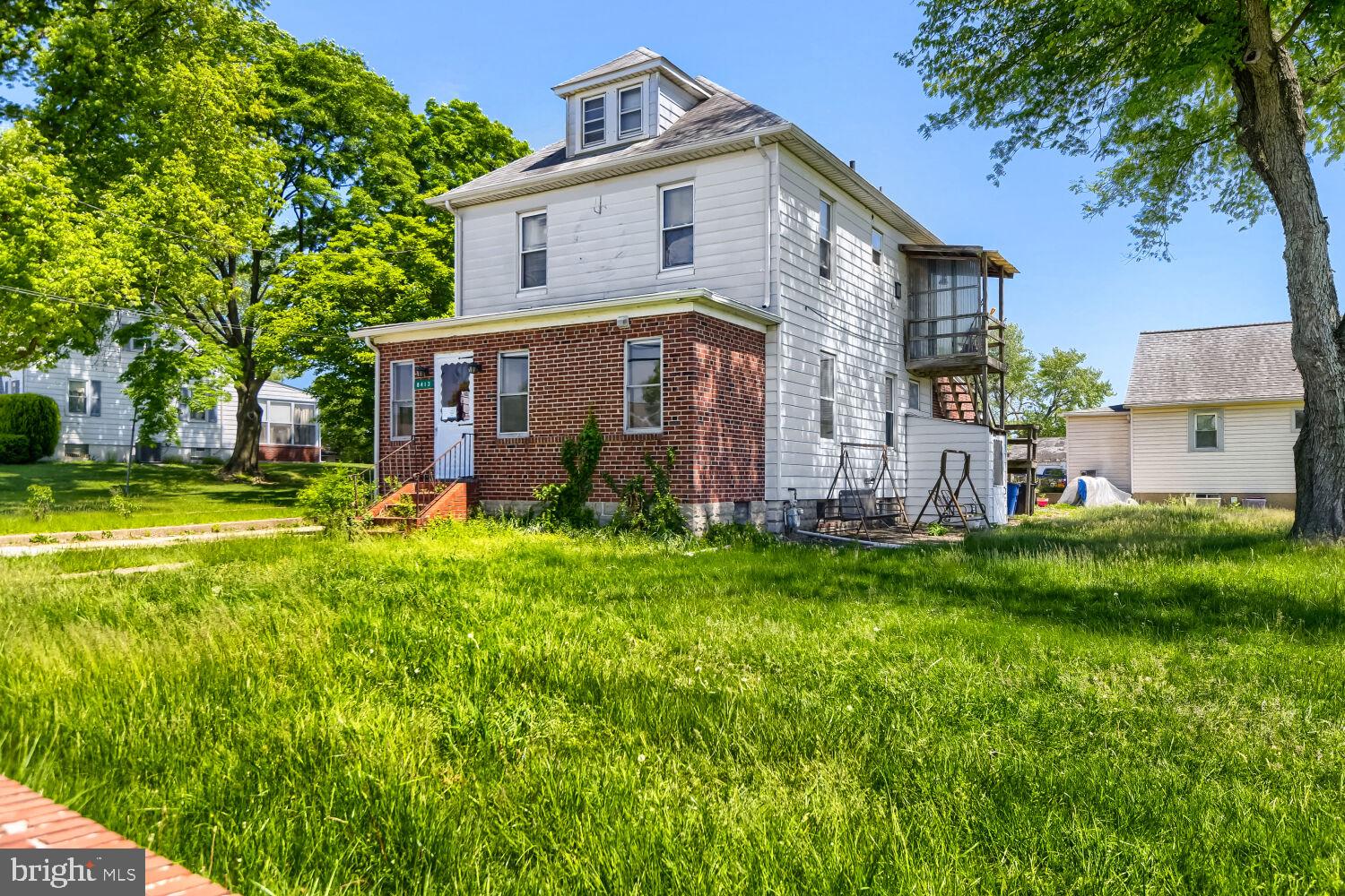 8413 Philadelphia Road Baltimore, MD 21237 - Photo 4 of 27 Charming home with lush greenery.