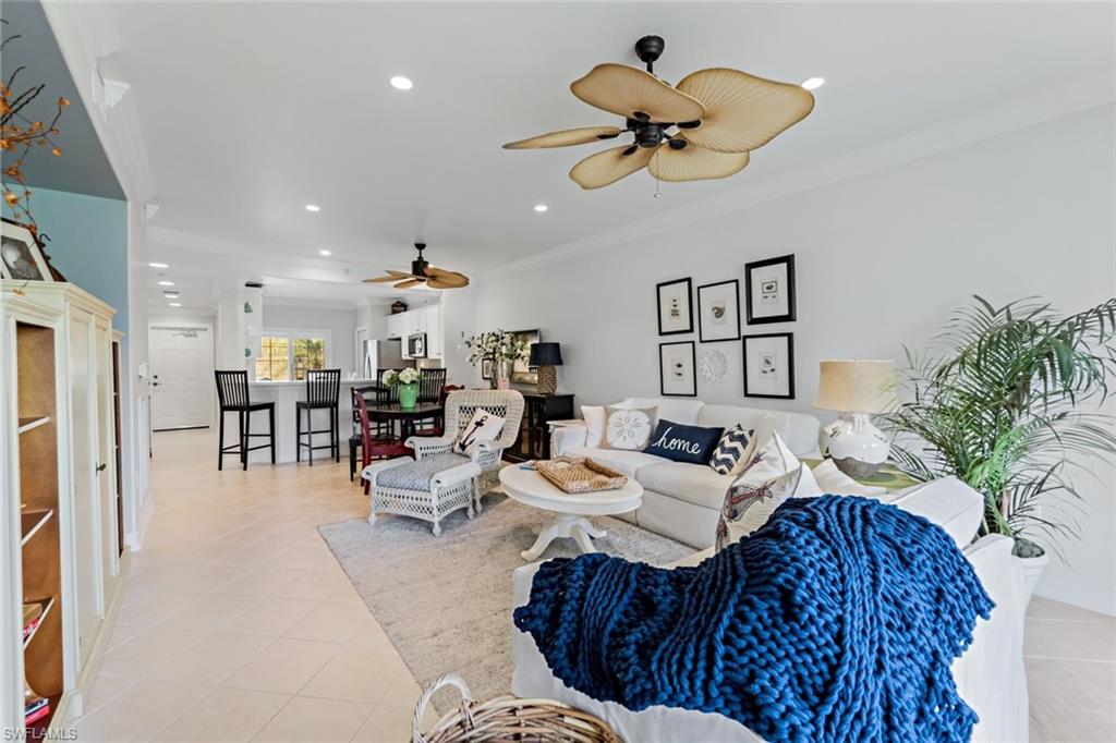 9128 Michael Circle, Unit 9903 Naples, FL 34113 - Photo 11 of 25 a living room with furniture