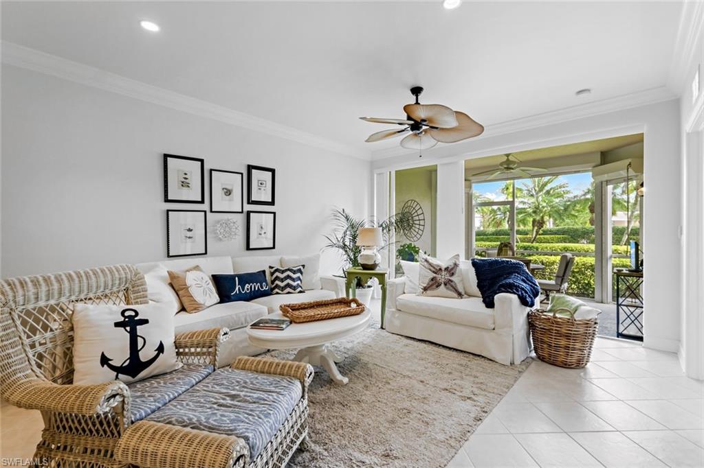 9128 Michael Circle, Unit 9903 Naples, FL 34113 - Photo 12 of 25 a living room with furniture and a large window