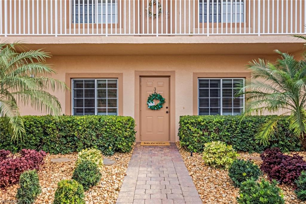 9128 Michael Circle, Unit 9903 Naples, FL 34113 - Photo 3 of 25 front view of a house
