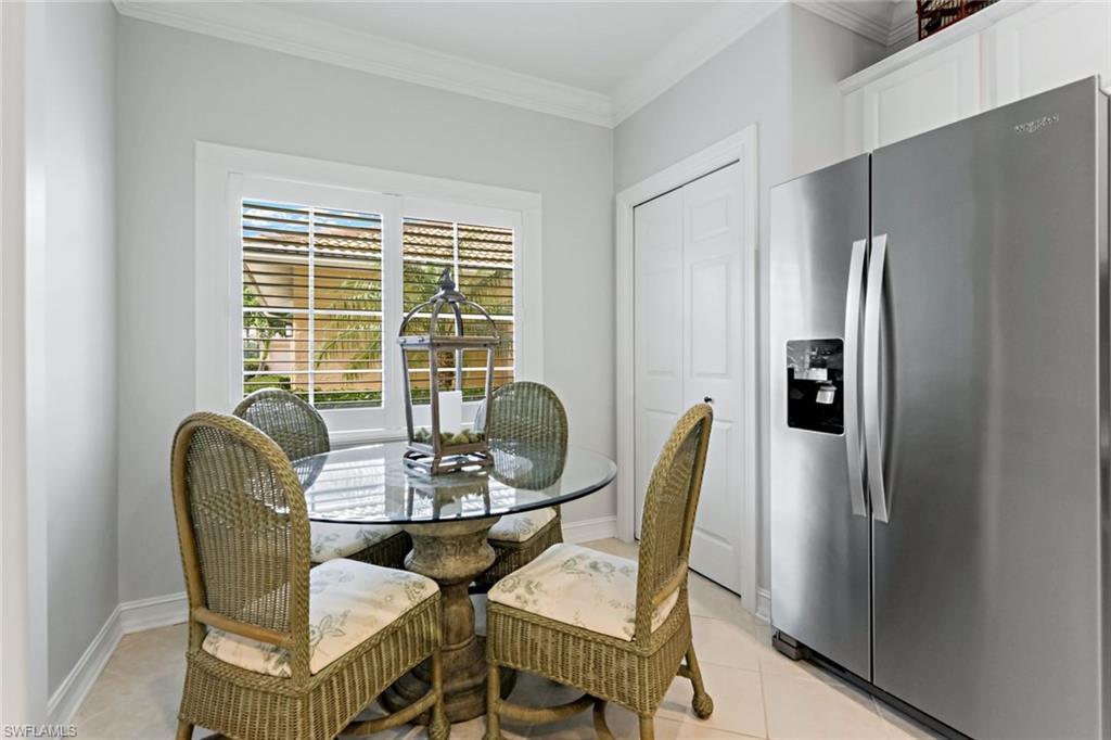 9128 Michael Circle, Unit 9903 Naples, FL 34113 - Photo 7 of 25 a dining room with furniture and window