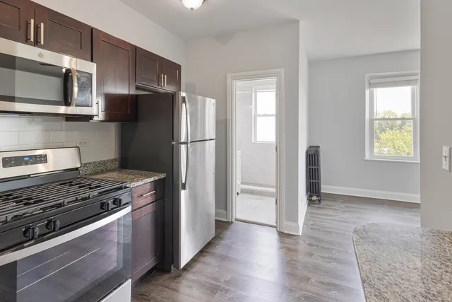 a kitchen with a stove and a refrigerator